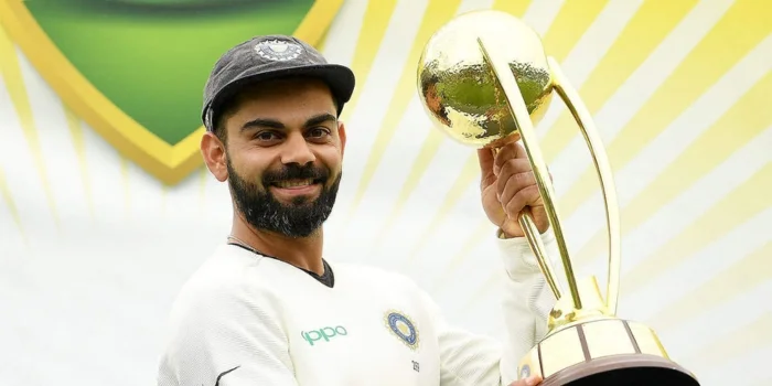 Virat Kohli holding Border Gavaskar Trophy